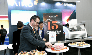 Thomas Bywater - Country Head AIKO ANZ cutting cake celebrating 15th Anniversary
